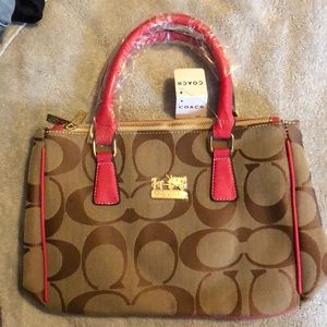 Knock off coach. Comes in dust bag.